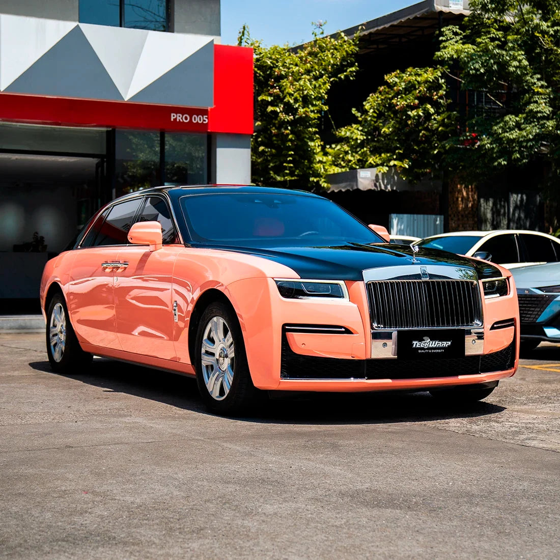High Gloss Amber Rose Vinyl Wrap on Rolls Royce Three-Fourth View
