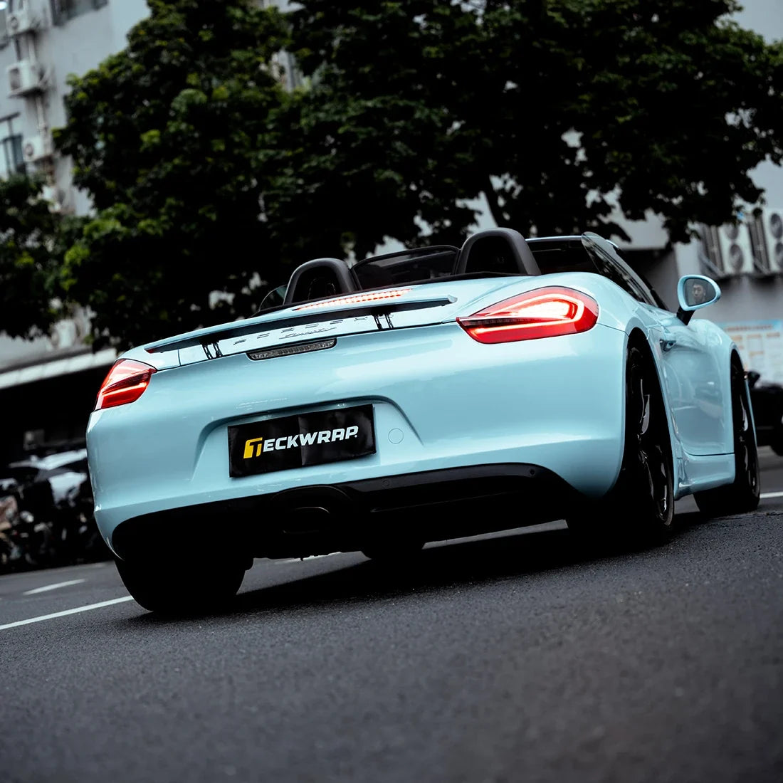 High Gloss Bali Blue Vinyl Wrap on Porsche back angled