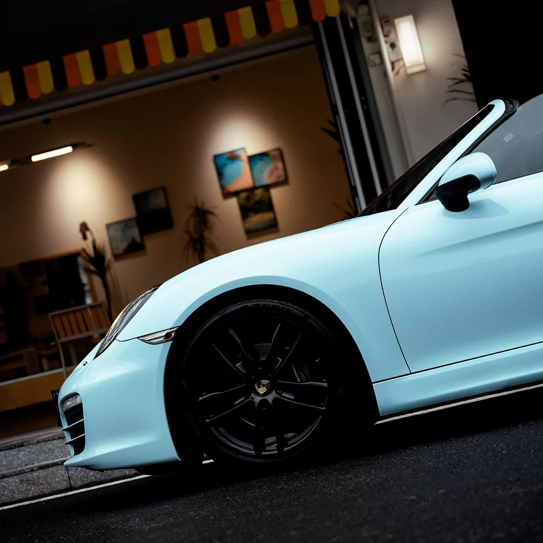 High Gloss Bali Blue Vinyl Wrap on Porsche Close-Up View