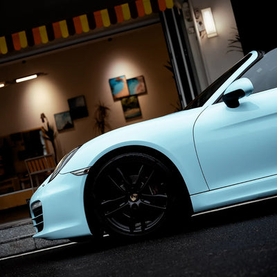 High Gloss Bali Blue Vinyl Wrap on Porsche Close-Up View