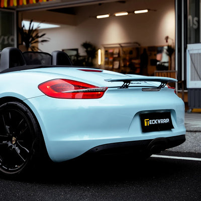 High Gloss Bali Blue Vinyl Wrap on Porsche Rear Bumper Close-Up