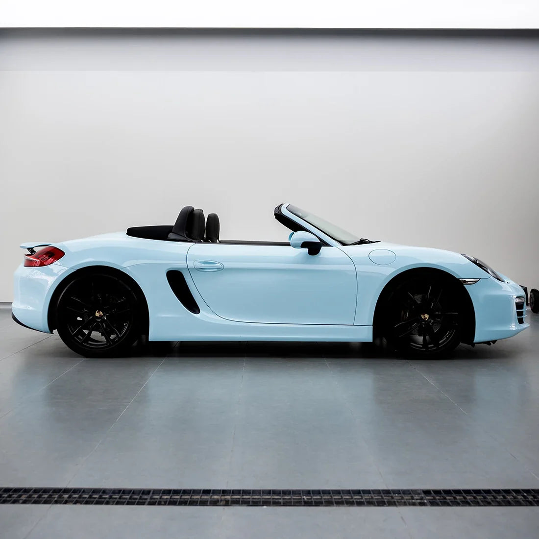 High Gloss Bali Blue Vinyl Wrap on Porsche Side View