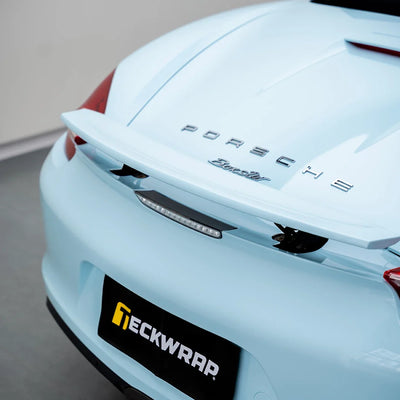 High Gloss Bali Blue Vinyl Wrap on Porsche Rear Wing Close-Up