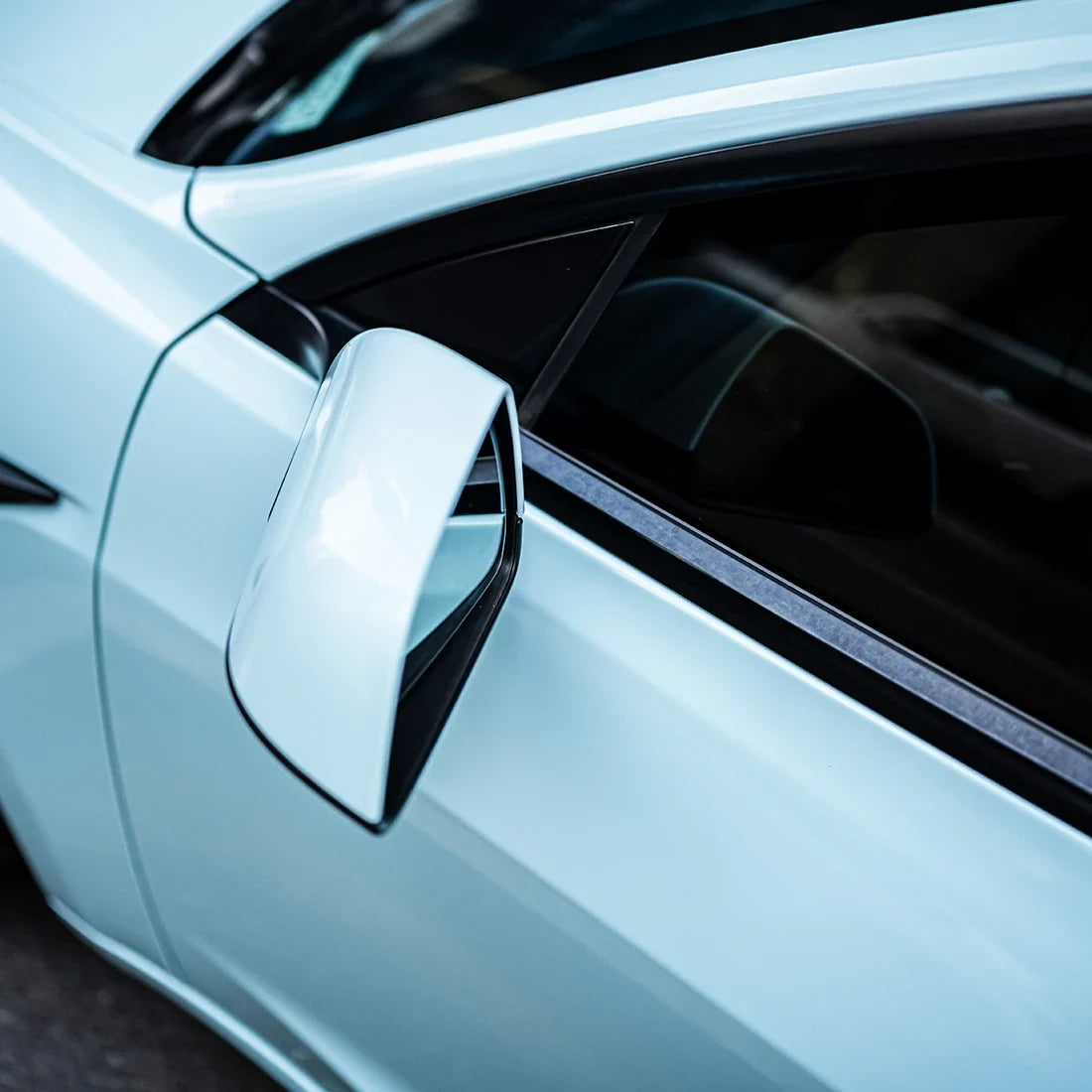 High Gloss Bali Blue Vinyl Wrap on Tesla Mirror Close-Up