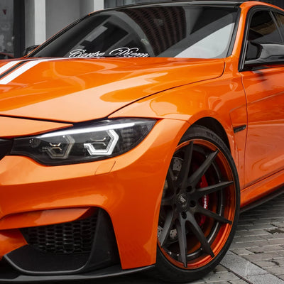High Gloss Tangerine Orange Vinyl Wrap on BMW M3 Front Close-Up