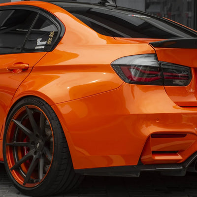 High Gloss Tangerine Orange Vinyl Wrap on BMW M3 Rear Angle View