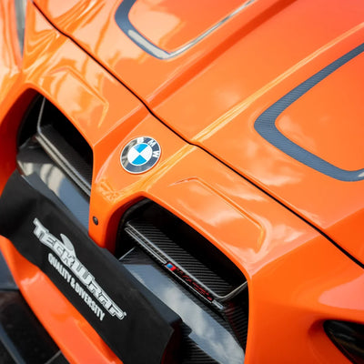 High Gloss Tangerine Orange Vinyl Wrap on BMW M4 Hood Angle View