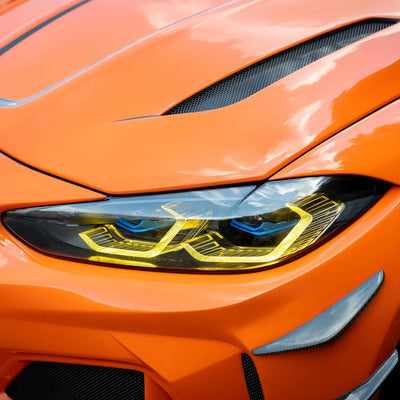 High Gloss Tangerine Orange Vinyl Wrap on BMW M4 Headlight Close-Up