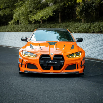 High Gloss Tangerine Orange Vinyl Wrap on BMW M4 Front Angle View