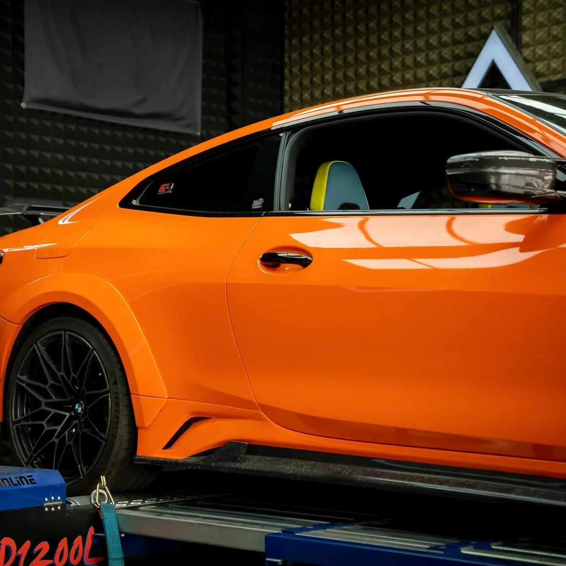 High Gloss Tangerine Orange Vinyl Wrap on BMW M4 Rear Angle View