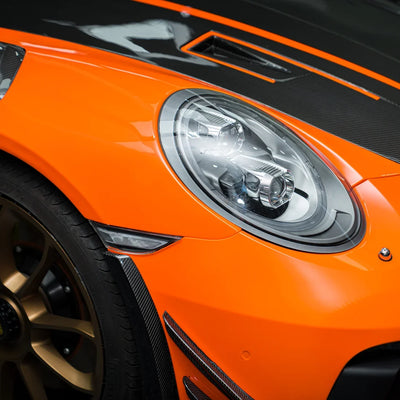 High Gloss Tangerine Orange Vinyl Wrap on Porsche Front Close-Up