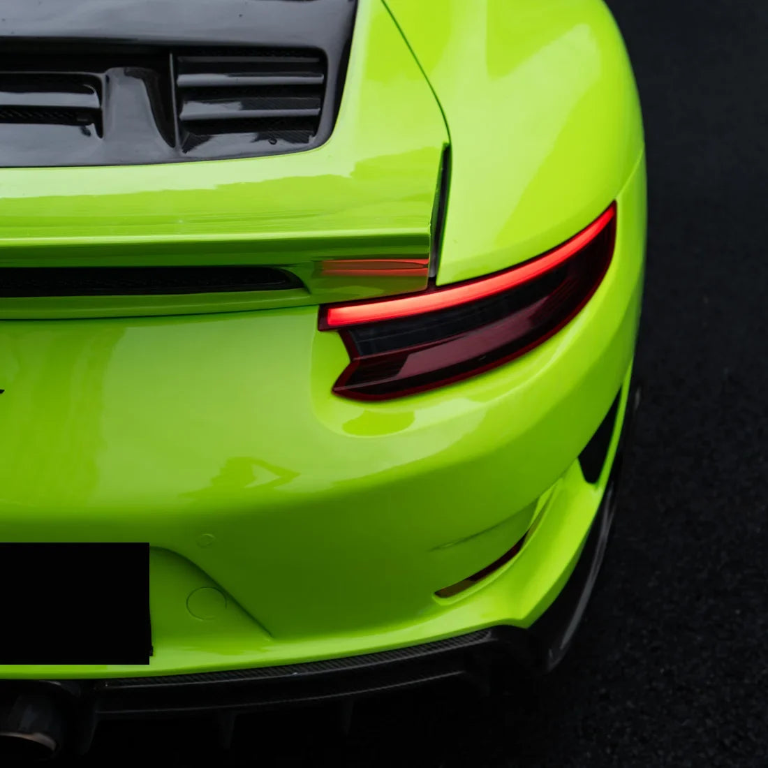 High Gloss Gecko Green Vinyl Wrap on Porsche 911 Rear Close-Up