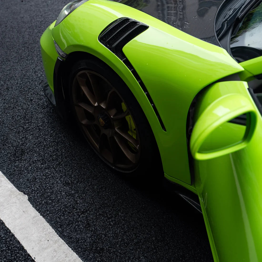 High Gloss Gecko Green Vinyl Wrap on Porsche 911 Front Angle View