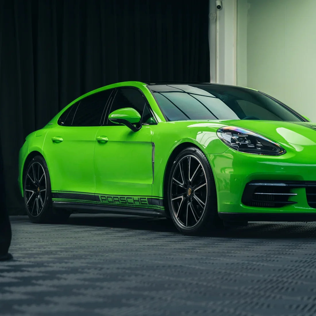 High Gloss Gecko Green Vinyl Wrap on Porsche Rear Angle View