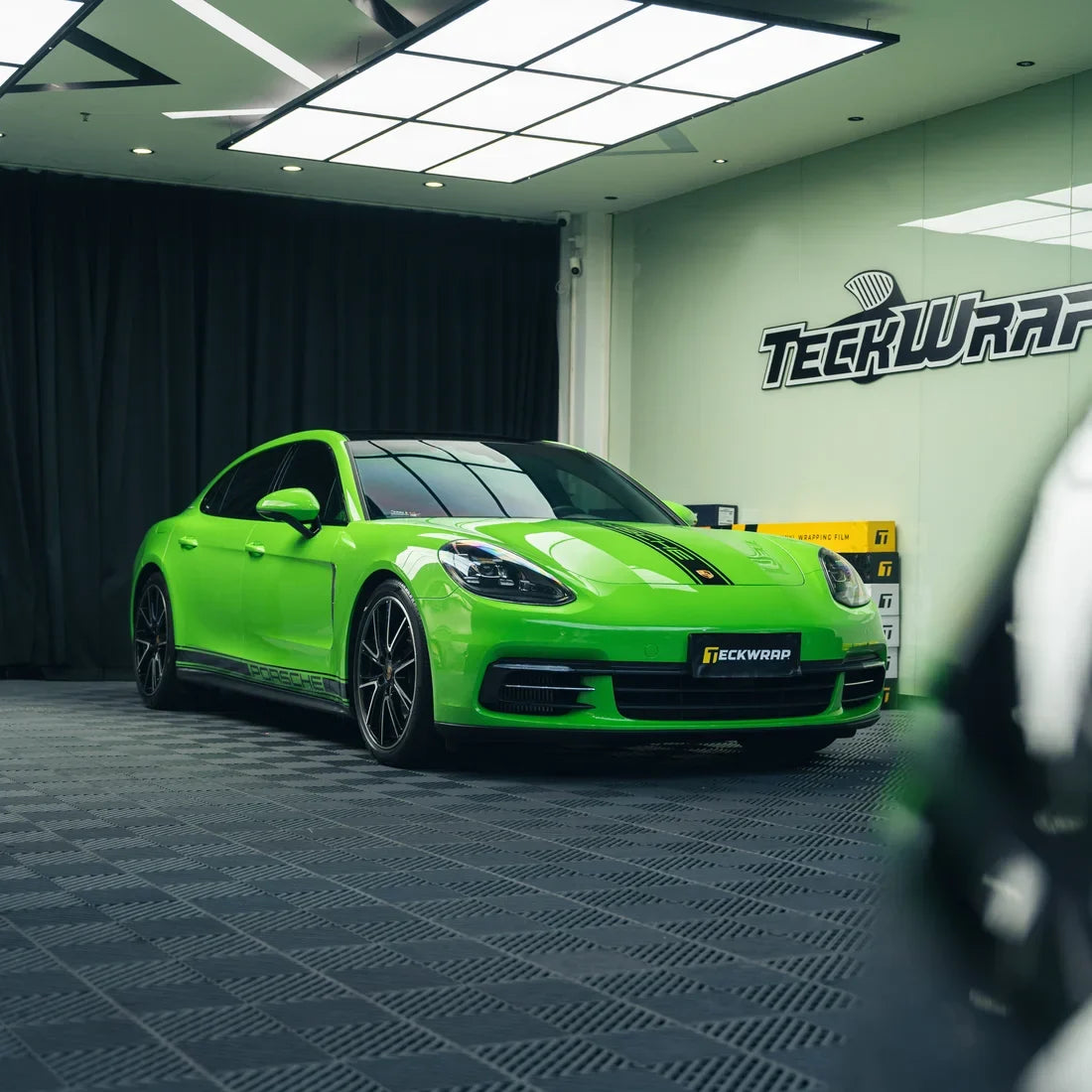 High Gloss Gecko Green Vinyl Wrap on Porsche Side Angle View