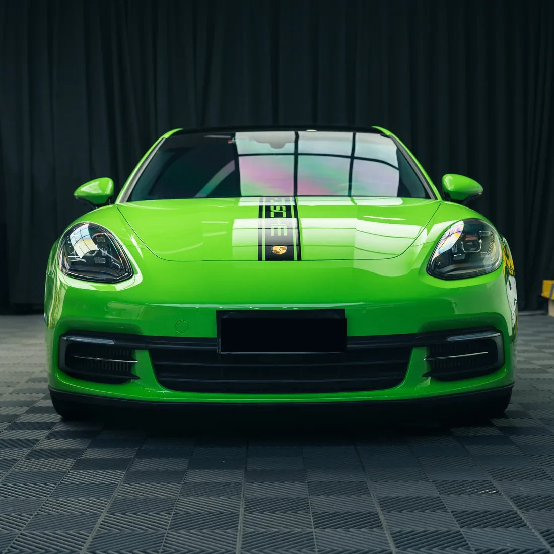 High Gloss Gecko Green Vinyl Wrap on Porsche Front Angle View