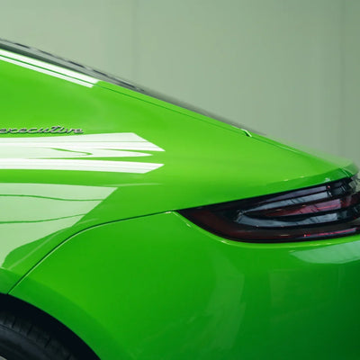 High Gloss Gecko Green Vinyl Wrap on Porsche Front Close-Up