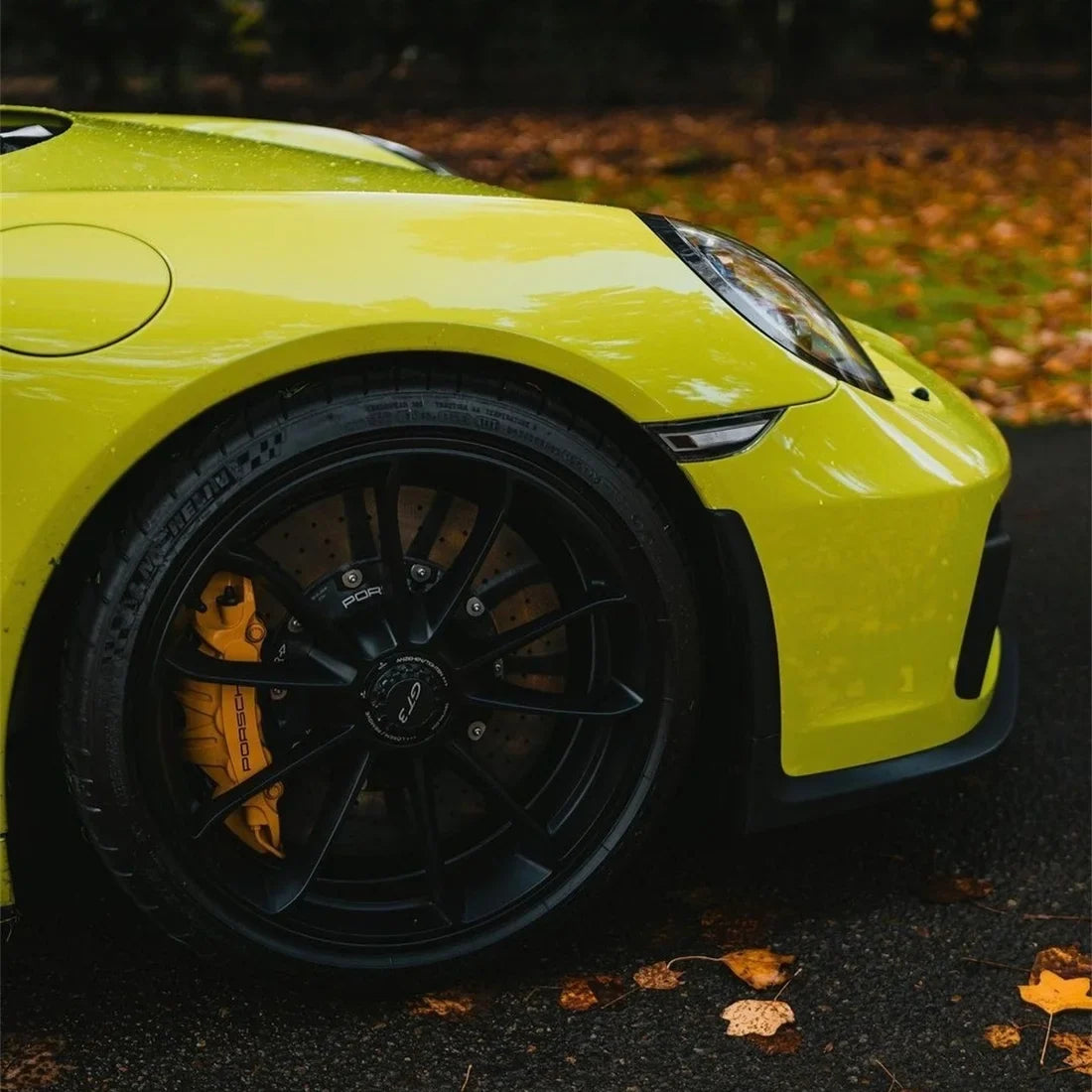 High Gloss Grape Green Vinyl Wrap on Porsche Wheel Close-Up