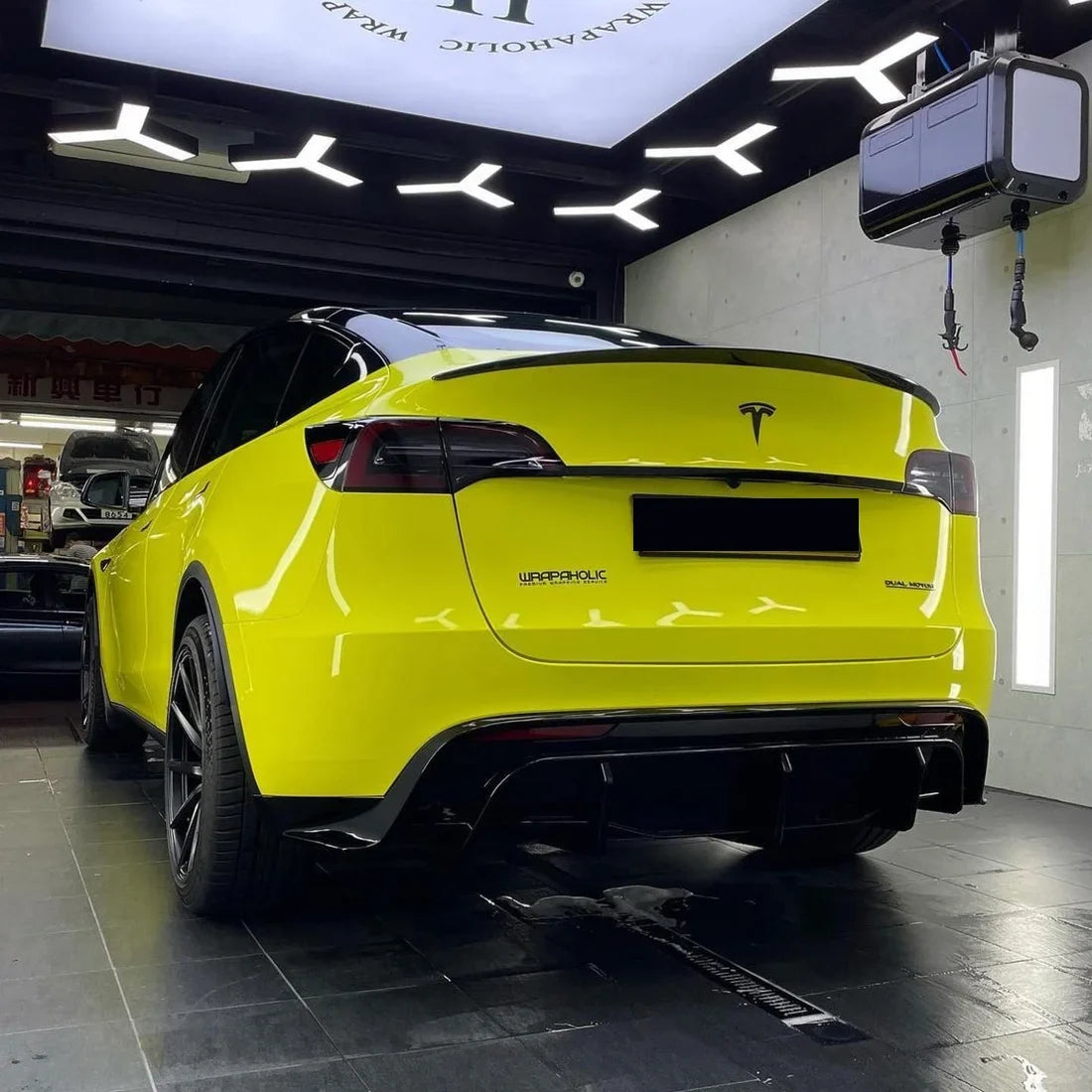 High Gloss Grape Green Vinyl Wrap on Tesla Front Angle View