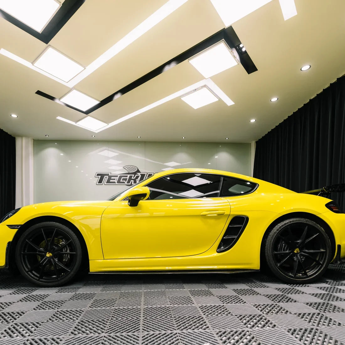 High Gloss Louvre Yellow Vinyl Wrap on Porsche Front Angle View