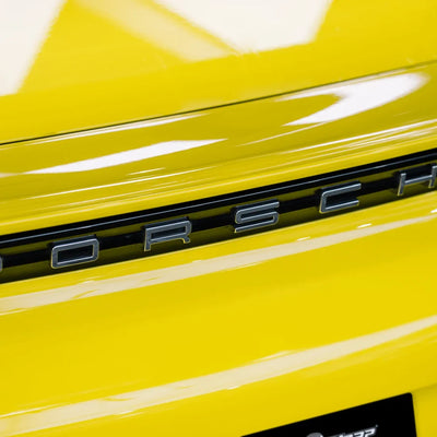 High Gloss Louvre Yellow Vinyl Wrap on Porsche Hood Angle View