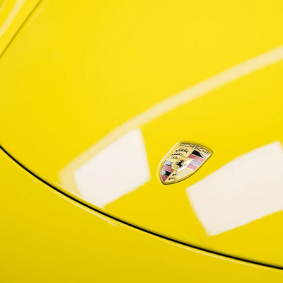 High Gloss Louvre Yellow Vinyl Wrap on Porsche Hood Close-Up