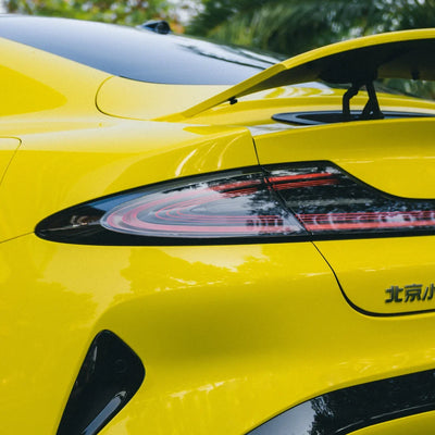 High Gloss Louvre Yellow Vinyl Wrap on Xiaomi Rear Angle View