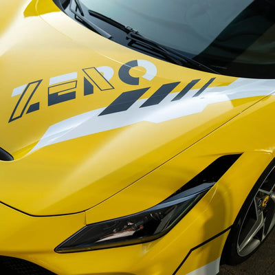 High Gloss Sunray Yellow Vinyl Wrap on Ferrari Front Side View
