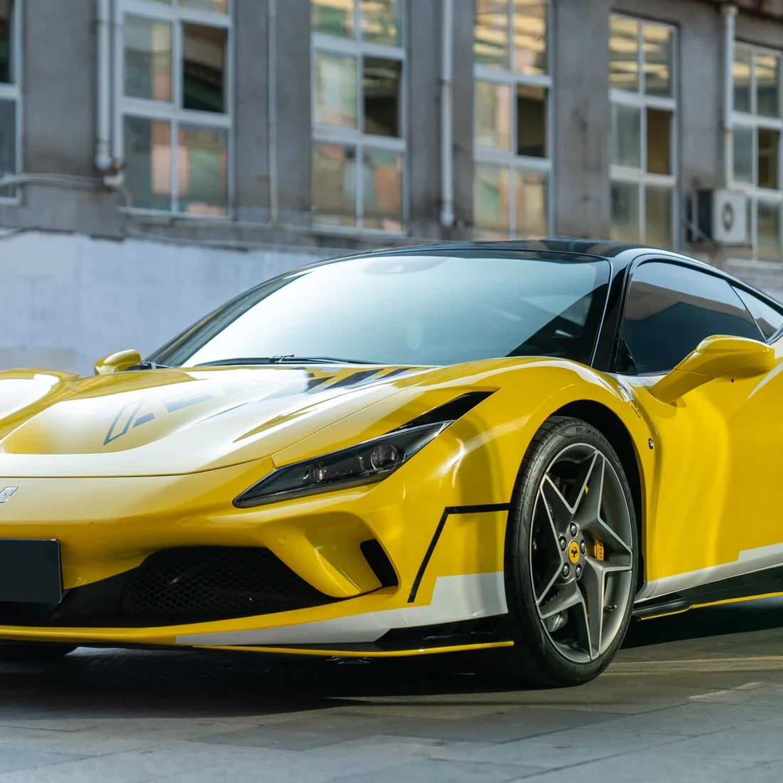 High Gloss Sunray Yellow Vinyl Wrap on Ferrari Front Angle View