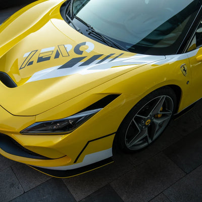 High Gloss Sunray Yellow Vinyl Wrap on Ferrari Side Angle View