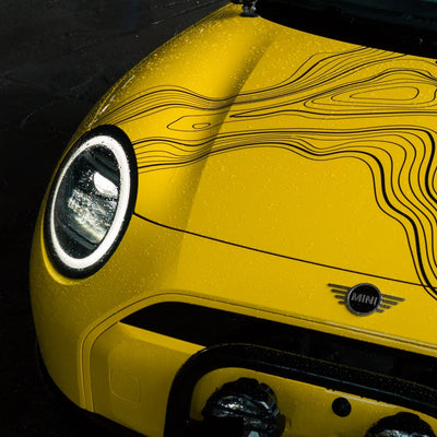 High Gloss Sunray Yellow Vinyl Wrap on Mini Cooper Wheel Close-Up