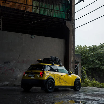High Gloss Sunray Yellow Vinyl Wrap on Mini Cooper Rear Garage View