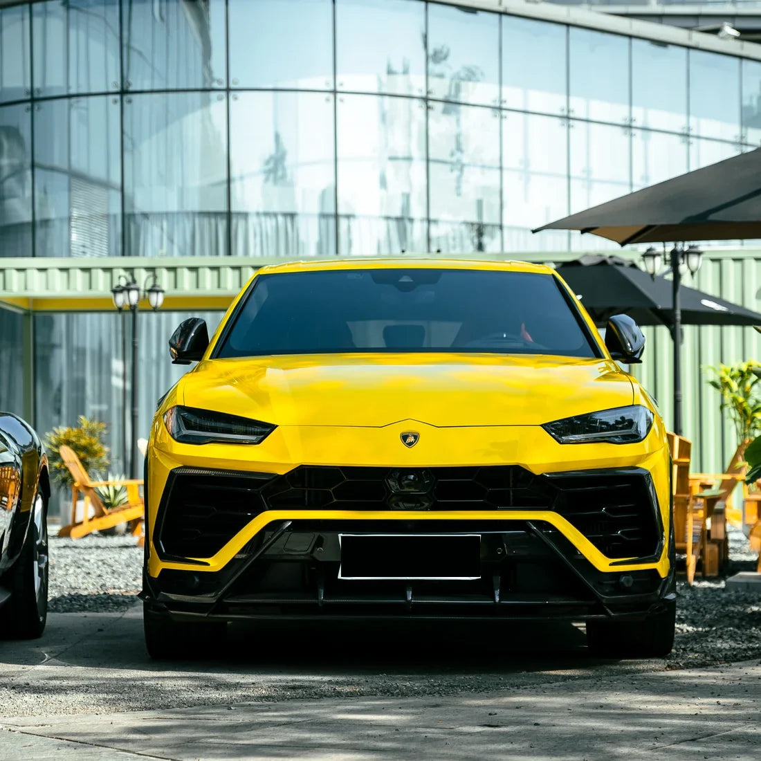 High Gloss Sunray Yellow Vinyl Wrap on Lamborghini Urus Front View