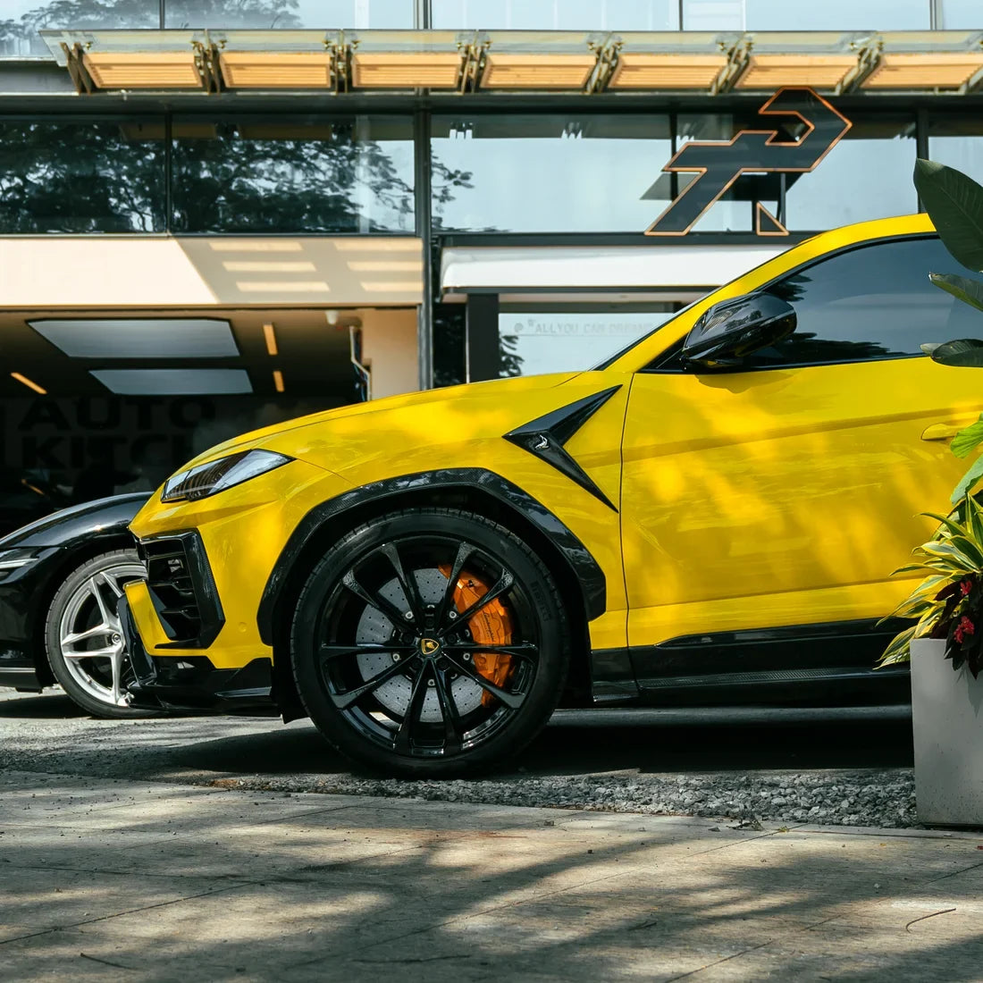 High Gloss Sunray Yellow Vinyl Wrap on Lamborghini Urus Side View