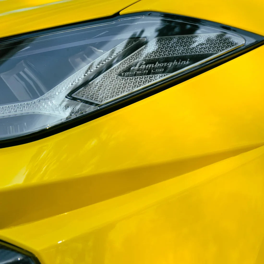 High Gloss Sunray Yellow Vinyl Wrap on Lamborghini Urus Hood Angle