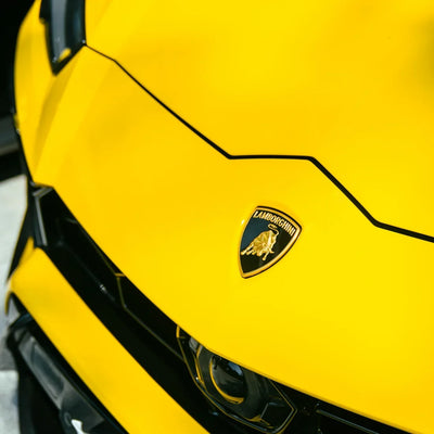 High Gloss Sunray Yellow Vinyl Wrap on Lamborghini Urus Hood View