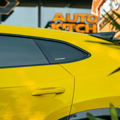 High Gloss Sunray Yellow Vinyl Wrap on Lamborghini Urus Side Close-Up
