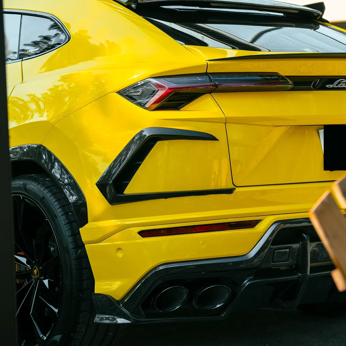 High Gloss Sunray Yellow Vinyl Wrap on Lamborghini Urus Rear Close-Up