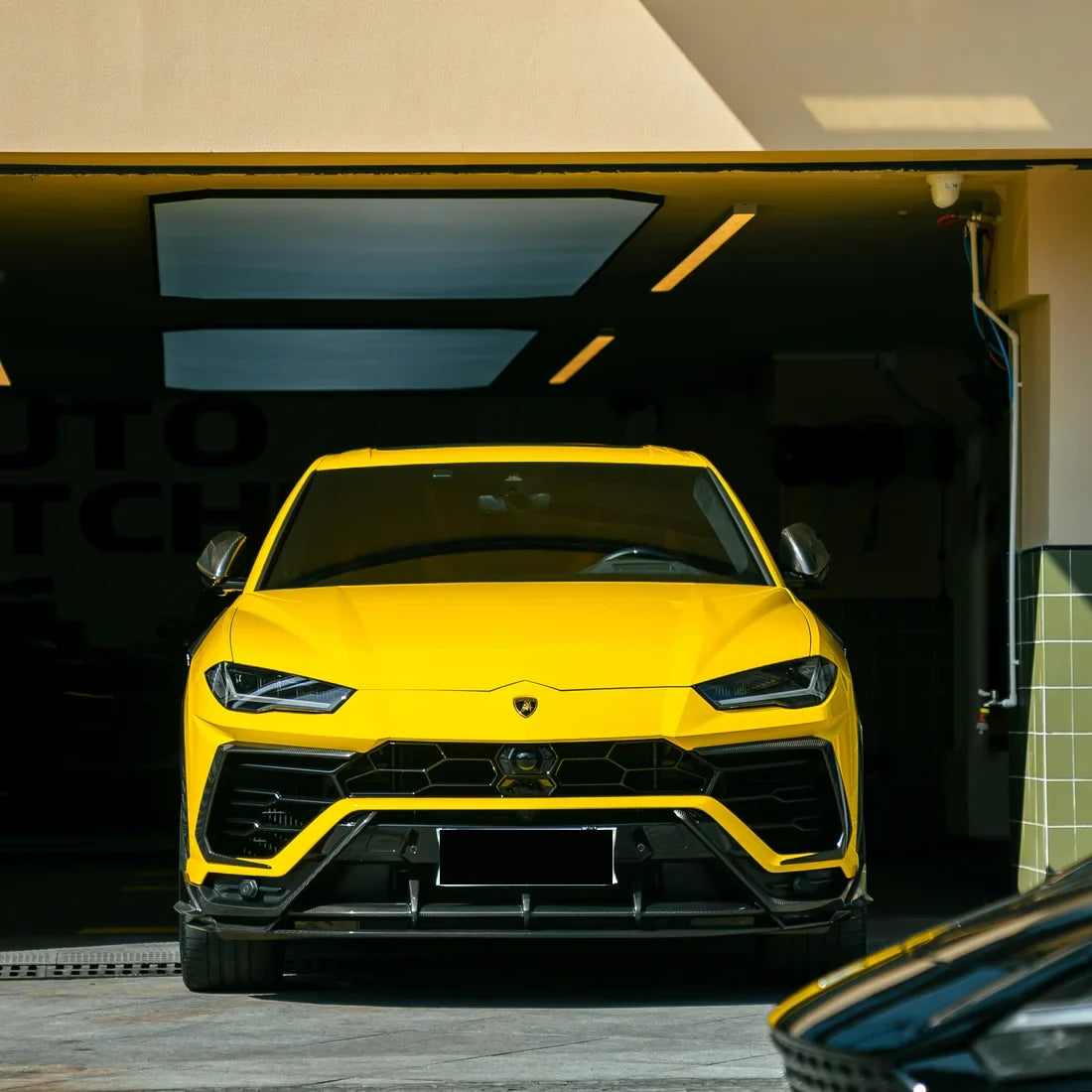High Gloss Sunray Yellow Vinyl Wrap on Lamborghini Urus Front Close-Up