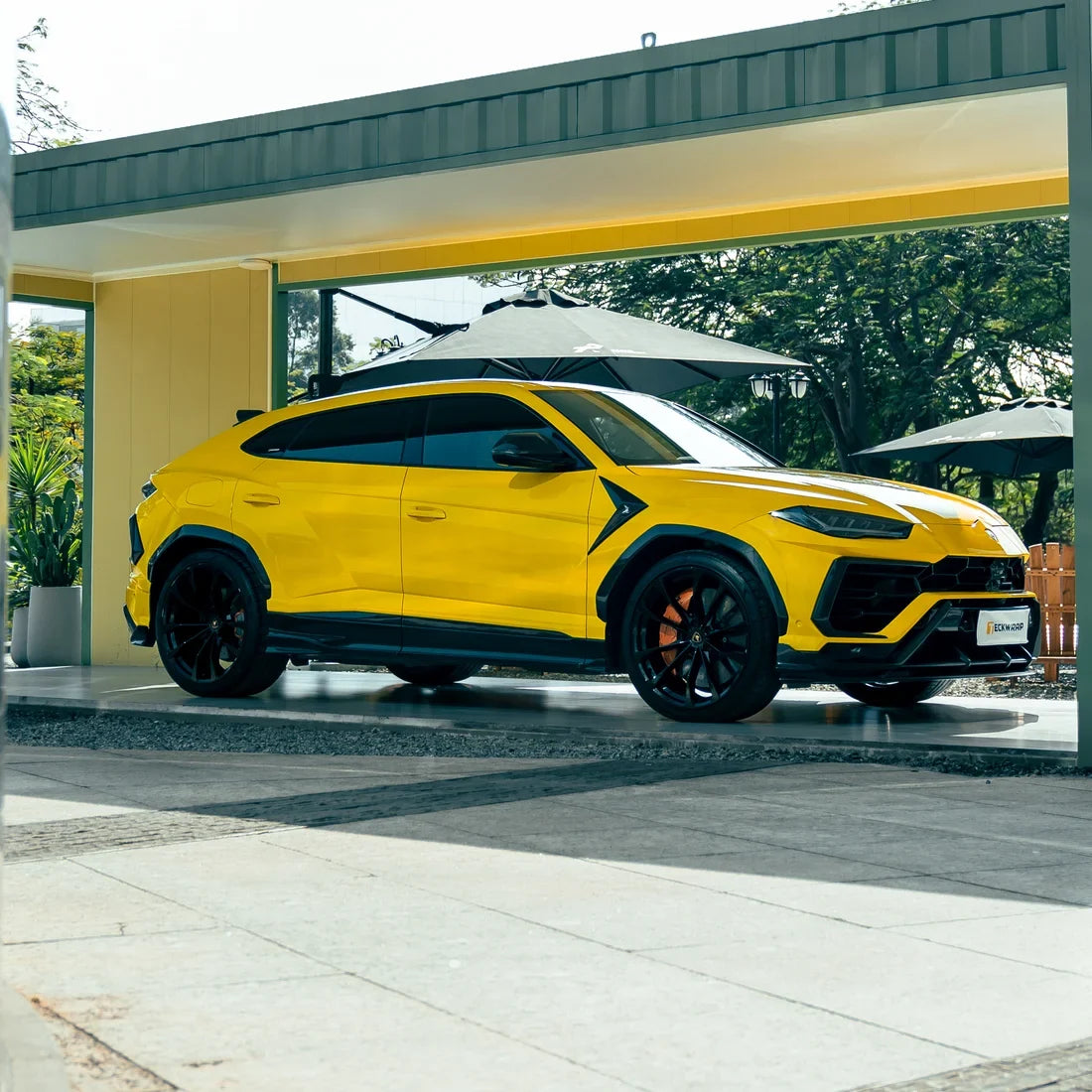 High Gloss Sunray Yellow Vinyl Wrap on Lamborghini Urus Side View