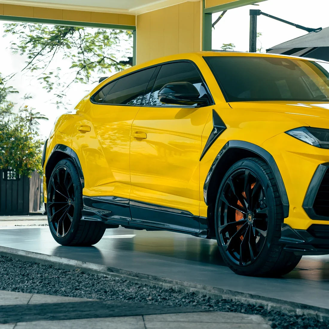 High Gloss Sunray Yellow Vinyl Wrap on Lamborghini Urus Side Full