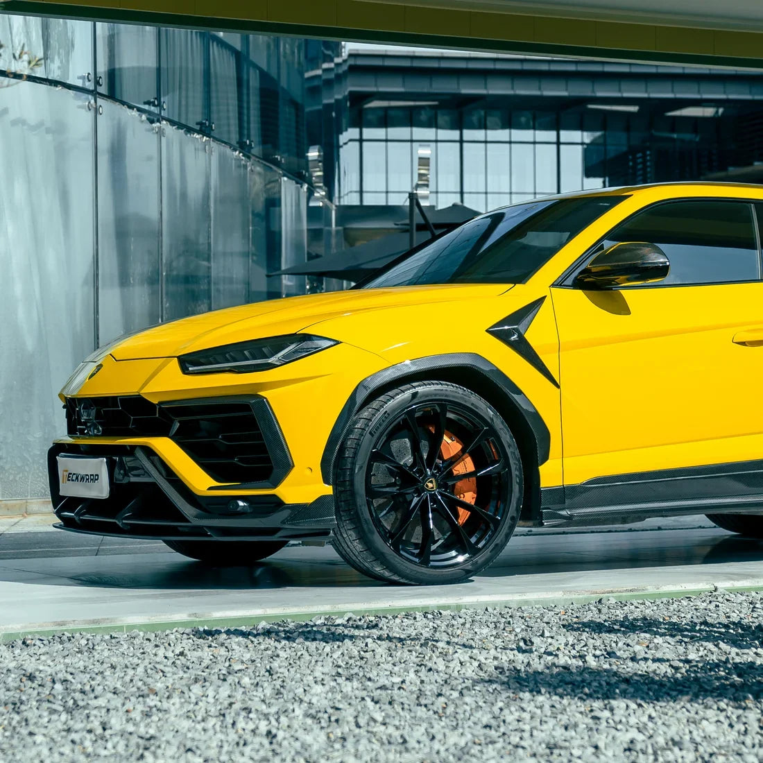 High Gloss Sunray Yellow Vinyl Wrap on Lamborghini Urus Rear Angle