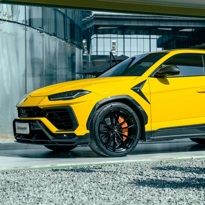High Gloss Sunray Yellow Vinyl Wrap on Lamborghini Urus Rear Angle