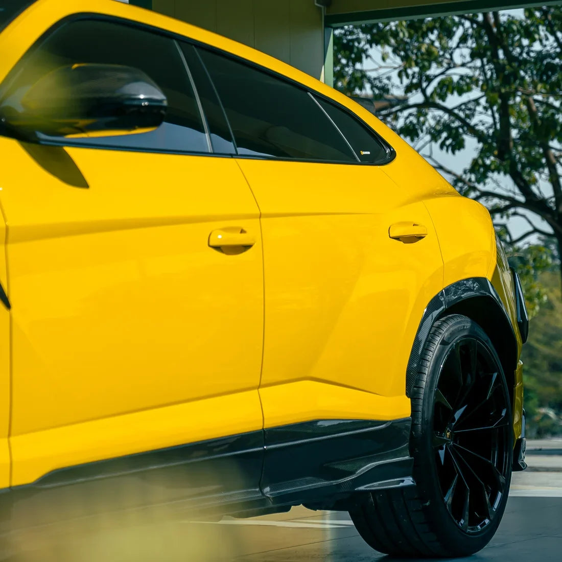 High Gloss Sunray Yellow Vinyl Wrap on Lamborghini Urus Side Angle