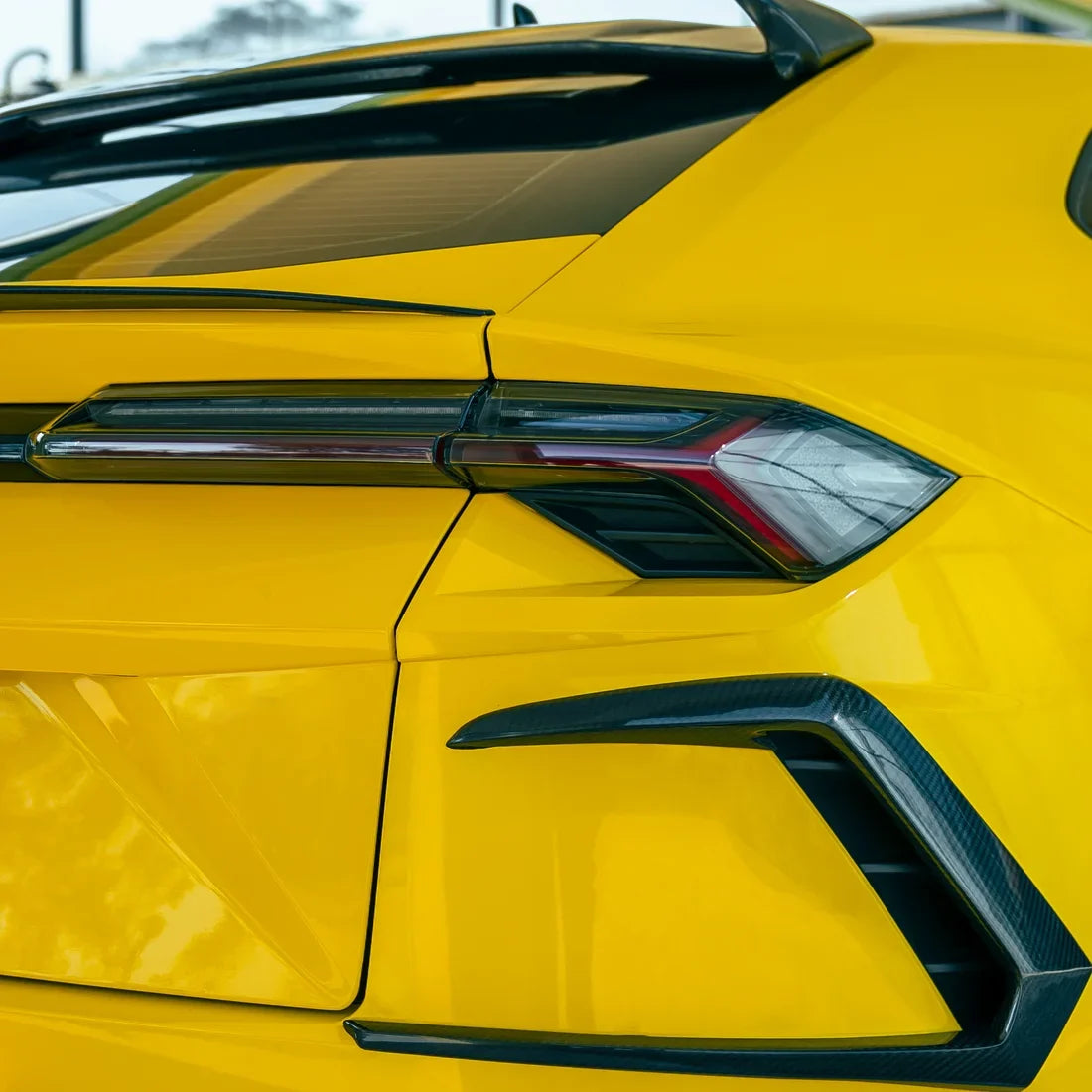 High Gloss Sunray Yellow Vinyl Wrap on Lamborghini Urus Headlight Close-Up