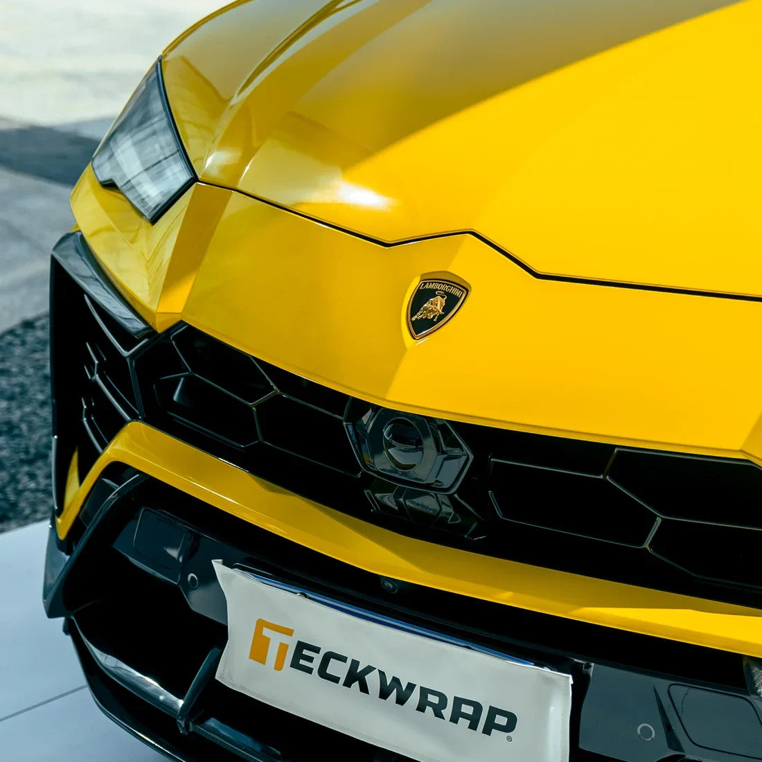 High Gloss Sunray Yellow Vinyl Wrap on Lamborghini Urus Side Front