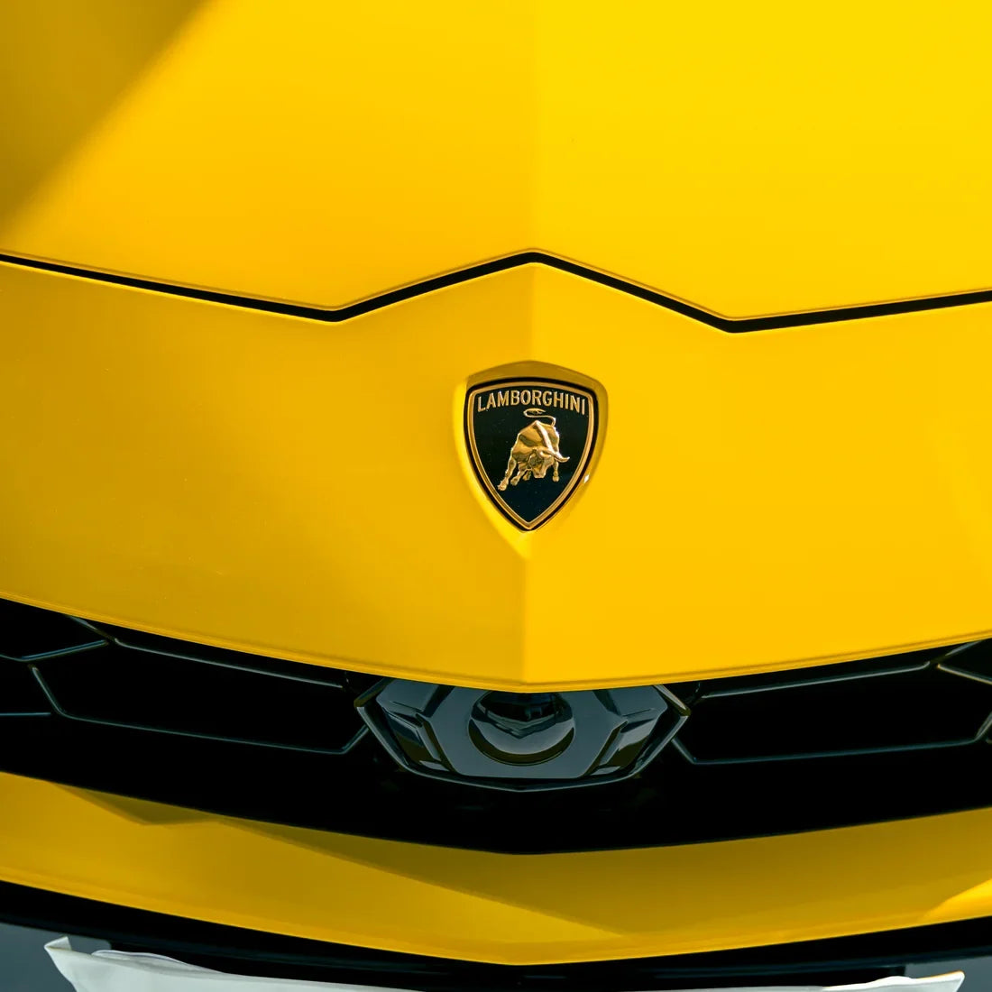 High Gloss Sunray Yellow Vinyl Wrap on Lamborghini Urus Front View