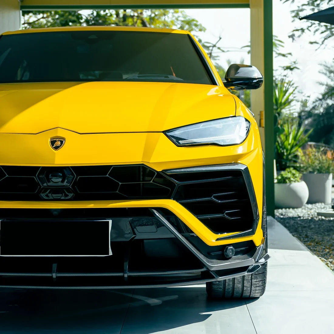 High Gloss Sunray Yellow Vinyl Wrap on Lamborghini Urus Front Close Up View