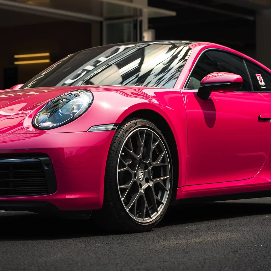 Porsche showcasing a High Gloss Berry Red Vinyl Wrap