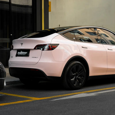 Tesla in High Gloss Strawberry Milk Vinyl Wrap back view.
